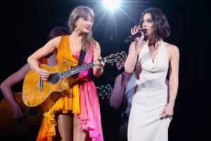 Tavia Hunt, the wife of the owner of the Kansas City Chiefs, poses with Taylor Swift's parents during the Eras Tour in Toronto.