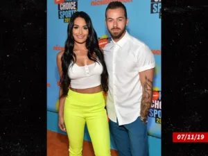 Speaking out about Artem Chigvintsev's divorce, Nikki Bella said, "I'm heartbroken."